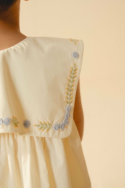 Cecile | Cream pleated dress with hand-embroidered collar