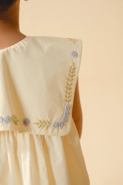 Cecile | Cream pleated dress with hand-embroidered collar