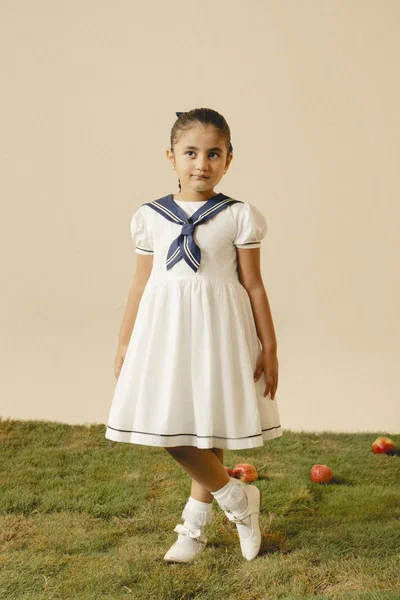Camellia | White cotton dress with sailor collar and pleated skirt