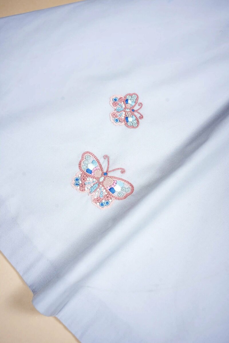 Lullaby | Pure cotton dress with hand-embroidered butterfly motifs
