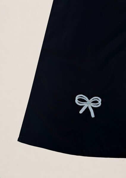 Notte | Black cotton dress with hand-embroidered bow details